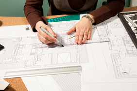 Close up of architect hands working on blueprints Close up of architect hands working on blueprints. Design and pan. Professional drawing of architect plans