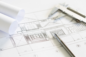 Construction plans and drawing tools on blueprints Construction plans and drawing tools on blueprints